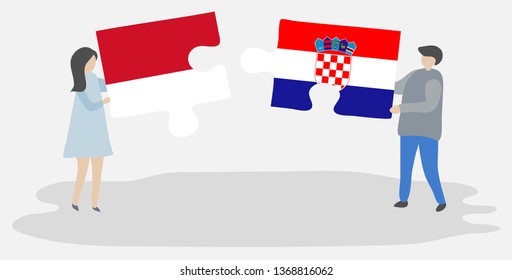 Couple holding two puzzles pieces with Indonesian and Croatian flags. Indonesia and Croatia national symbols together.