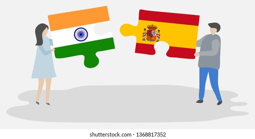 Couple holding two puzzles pieces with Indian and Spanish flags. India and Spain national symbols together.