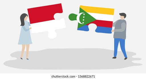 Couple holding two puzzles pieces with Indonesian and Comoran flags. Indonesia and Comoros national symbols together.
