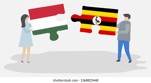 Couple holding two puzzles pieces with Hungarian and Ugandan flags. Hungary and Uganda national symbols together.