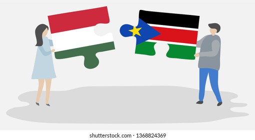 Couple holding two puzzles pieces with Hungarian and South Sudanese flags. Hungary and South Sudan national symbols together.