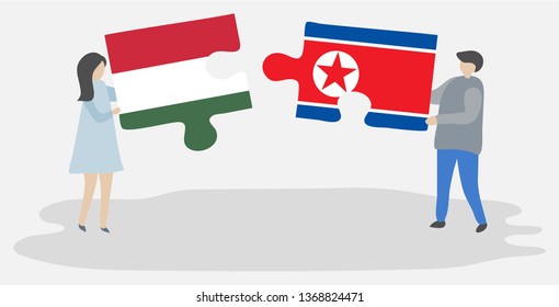 Couple holding two puzzles pieces with Hungarian and North Korean flags. Hungary and North Korea national symbols together.