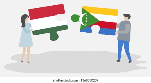 Couple holding two puzzles pieces with Hungarian and Comoran flags. Hungary and Comoros national symbols together.