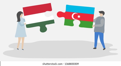 Couple holding two puzzles pieces with Hungarian and Azerbaijani flags. Hungary and Azerbaijan national symbols together.