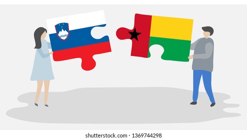 Couple holding two puzzles pieces with Slovenian and Bissau-Guinean flags. Slovenia and Guinea-Bissau national symbols together.