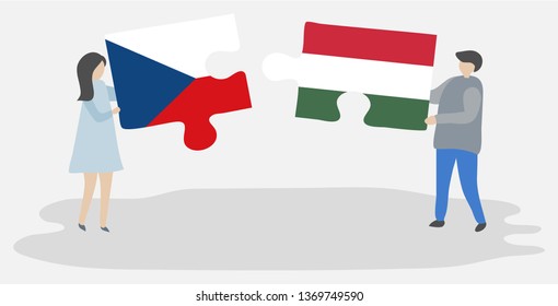 Couple holding two puzzles pieces with Czech and Hungarian flags. Czech Republic and Hungary national symbols together.