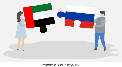 Couple holding two puzzles pieces with Emirian and Russian flags. United Arab Emirates and Russia national symbols together.