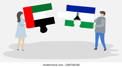 Couple holding two puzzles pieces with Emirian and Basotho flags. United Arab Emirates and Lesotho national symbols together.