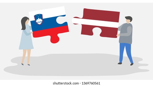 Couple holding two puzzles pieces with Slovenian and Latvian flags. Slovenia and Latvia national symbols together.