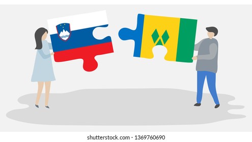 Couple holding two puzzles pieces with Slovenian and Vincentian flags. Slovenia and Saint Vincent and the Grenadines national symbols together.