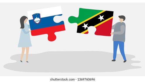 Couple holding two puzzles pieces with Slovenian and Kittitian flags. Slovenia and Saint Kitts and Nevis national symbols together.