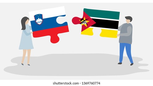 Couple holding two puzzles pieces with Slovenian and Mozambican flags. Slovenia and Mozambique national symbols together.