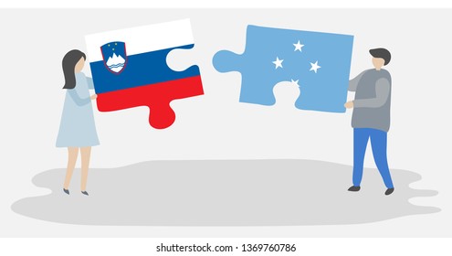 Couple holding two puzzles pieces with Slovenian and Micronesian flags. Slovenia and Micronesia national symbols together.