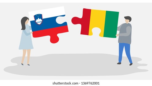 Couple holding two puzzles pieces with Slovenian and Guinean flags. Slovenia and Guinea national symbols together.