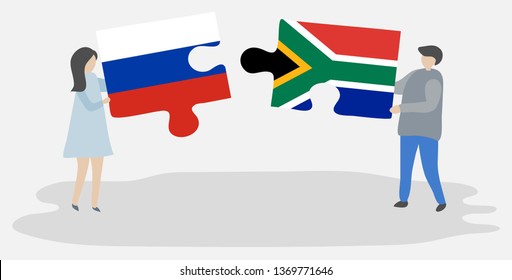 Couple holding two puzzles pieces with Russian and South African flags. Russia and South Africa national symbols together.