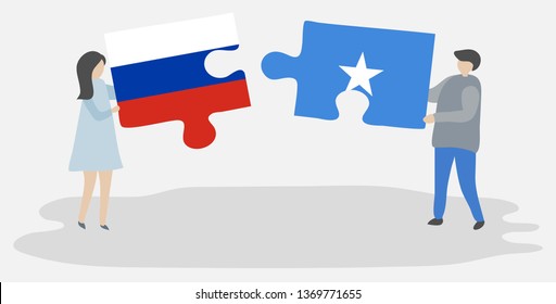 Couple holding two puzzles pieces with Russian and Somali flags. Russia and Somalia national symbols together.