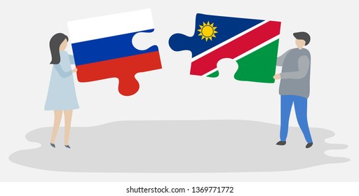 Couple holding two puzzles pieces with Russian and Namibian flags. Russia and Namibia national symbols together.