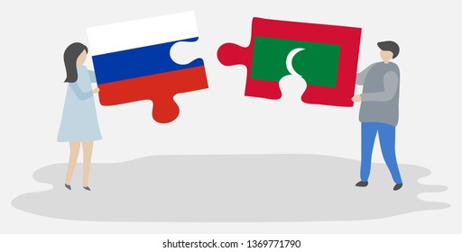 Couple holding two puzzles pieces with Russian and Maldivian flags. Russia and Maldives national symbols together.
