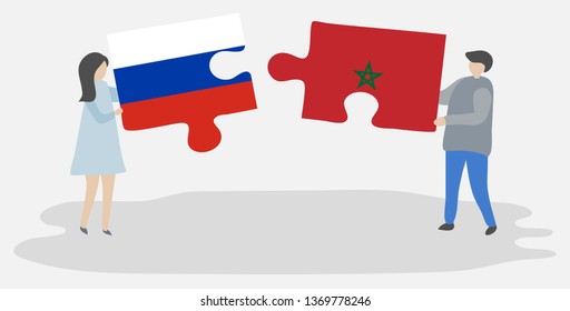 Couple holding two puzzles pieces with Russian and Moroccan flags. Russia and Morocco national symbols together.