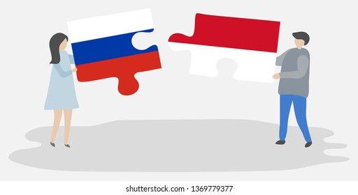 Couple holding two puzzles pieces with Russian and Indonesian flags. Russia and Indonesia national symbols together.