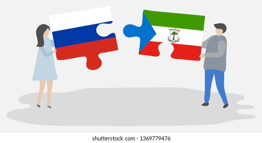 Couple holding two puzzles pieces with Russian and Equatorial Guinean flags. Russia and Equatorial Guinea national symbols together.