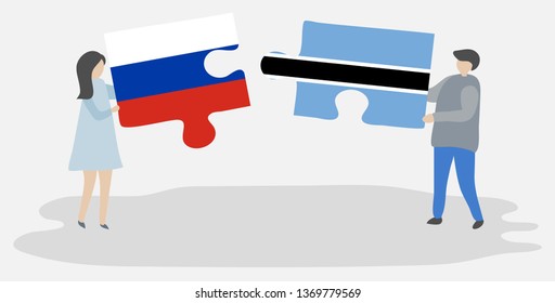 Couple holding two puzzles pieces with Russian and Motswana flags. Russia and Botswana national symbols together.
