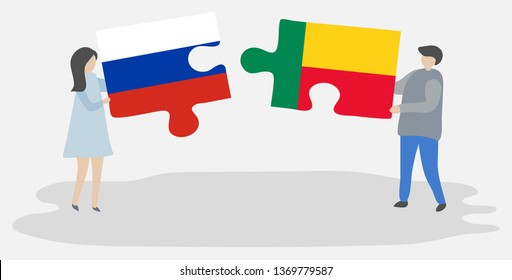 Couple holding two puzzles pieces with Russian and Beninese flags. Russia and Benin national symbols together.