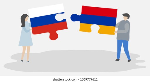 Couple holding two puzzles pieces with Russian and Armenian flags. Russia and Armenia national symbols together.