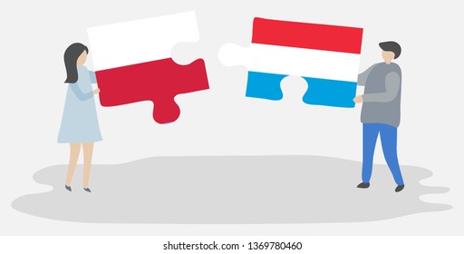 Couple holding two puzzles pieces with Polish and Luxembourgish flags. Poland and Luxembourg national symbols together.
