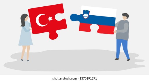 Couple holding two puzzles pieces with Turkish and Slovenian flags. Turkey and Slovenia national symbols together.