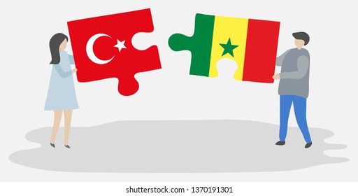 Couple holding two puzzles pieces with Turkish and Senegalese flags. Turkey and Senegal national symbols together.