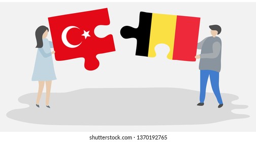 Couple holding two puzzles pieces with Turkish and Belgian flags. Turkey and Belgium national symbols together.