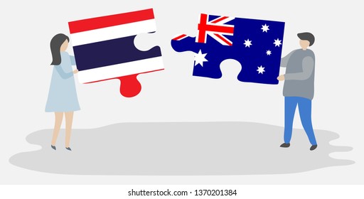 Couple holding two puzzles pieces with Thai and Australian flags. Thailand and Australia national symbols together.