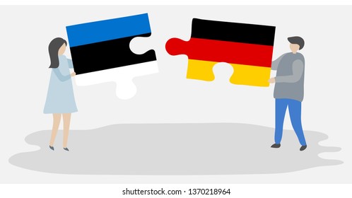 Couple holding two puzzles pieces with Estonian and German flags. Estonia and Germany national symbols together.