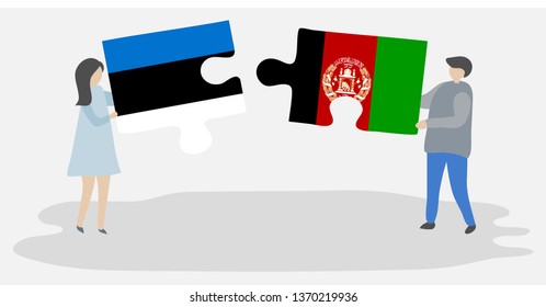 Couple holding two puzzles pieces with Estonian and Afghan flags. Estonia and Afghanistan national symbols together.
