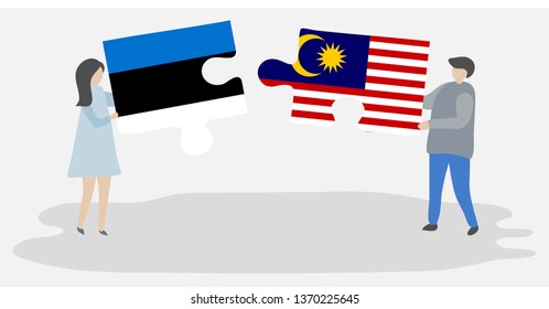 Couple holding two puzzles pieces with Estonian and Malaysian flags. Estonia and Malaysia national symbols together.