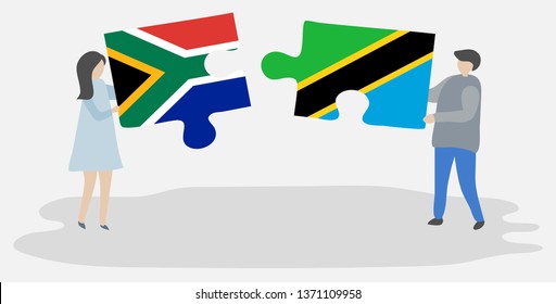 Couple holding two puzzles pieces with South African and Tanzanian flags. South Africa and Tanzania national symbols together.