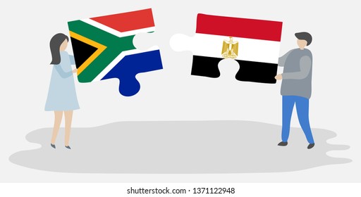 Couple holding two puzzles pieces with South African and Egyptian flags. South Africa and Egypt national symbols together.