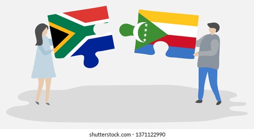 Couple holding two puzzles pieces with South African and Comoran flags. South Africa and Comoros national symbols together.