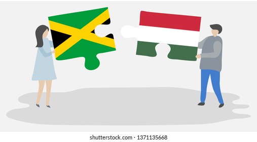 Couple holding two puzzles pieces with Jamaican and Hungarian flags. Jamaica and Hungary national symbols together.