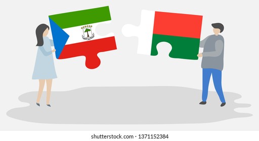 Couple holding two puzzles pieces with Equatorial Guinean and Malagasy flags. Equatorial Guinea and Madagascar national symbols together.