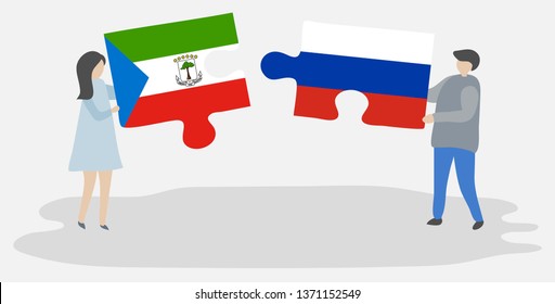 Couple holding two puzzles pieces with Equatorial Guinean and Russian flags. Equatorial Guinea and Russia national symbols together.