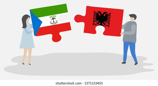Couple holding two puzzles pieces with Equatorial Guinean and Albanian flags. Equatorial Guinea and Albania national symbols together.