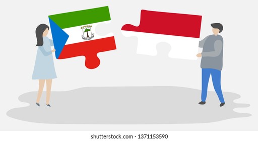 Couple holding two puzzles pieces with Equatorial Guinean and Indonesian flags. Equatorial Guinea and Indonesia national symbols together.