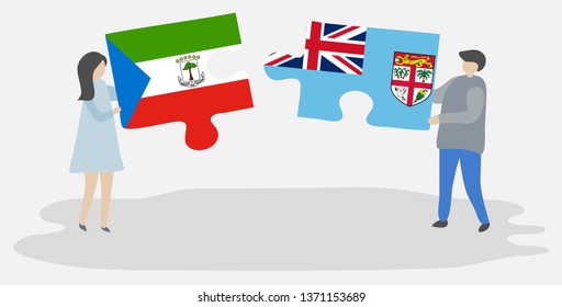 Couple holding two puzzles pieces with Equatorial Guinean and Fijian flags. Equatorial Guinea and Fiji national symbols together.