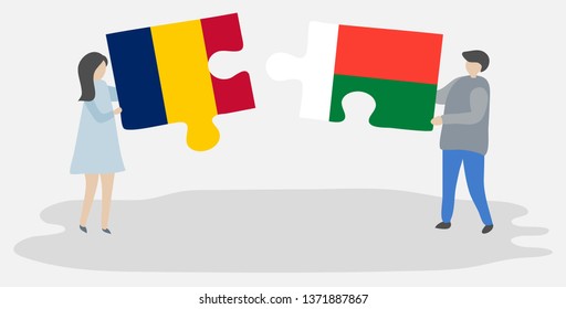Couple holding two puzzles pieces with Chadian and Malagasy flags. Chad and Madagascar national symbols together.