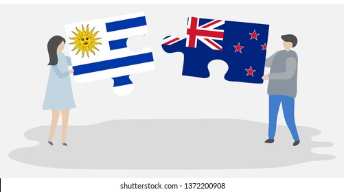 Couple holding two puzzles pieces with Uruguayan and NZ flags. Uruguay and New Zealand national symbols together.