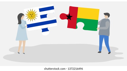 Couple holding two puzzles pieces with Uruguayan and Bissau-Guinean flags. Uruguay and Guinea-Bissau national symbols together.