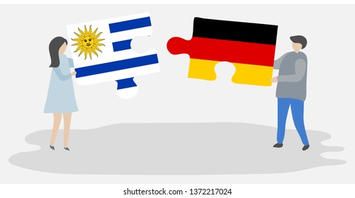 Couple holding two puzzles pieces with Uruguayan and German flags. Uruguay and Germany national symbols together.