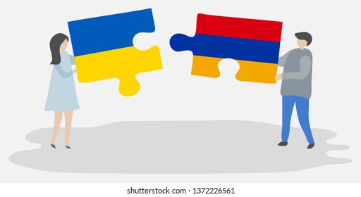 Couple holding two puzzles pieces with Ukrainian and Armenian flags. Ukraine and Armenia national symbols together.